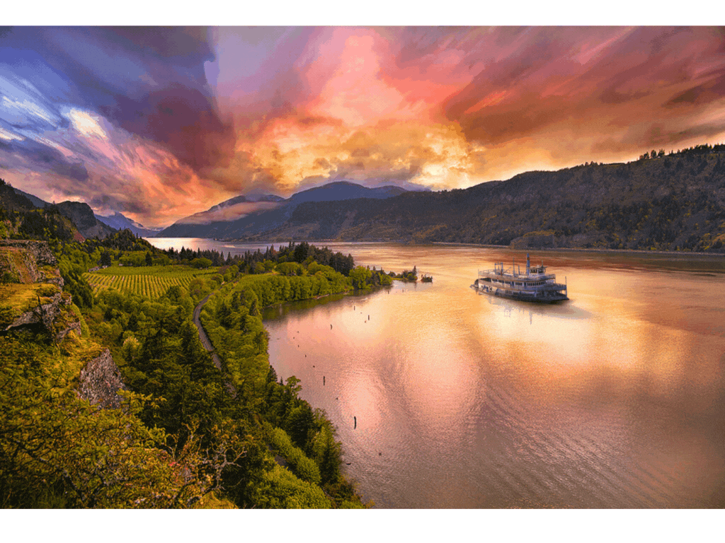 Sternwheeler cruising scenic Columbia River Gorge at sunset