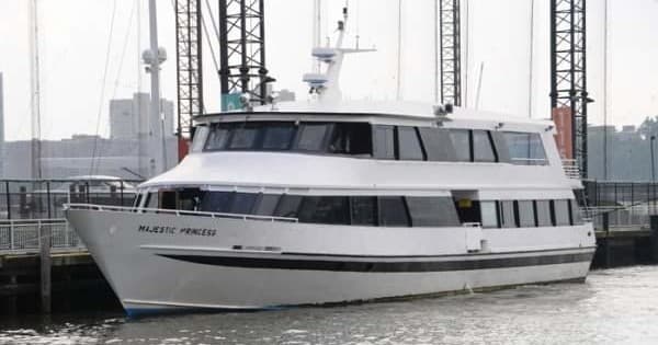 Majestic Harbor Cruises yacht docked at New York harbor pier