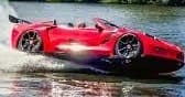 Red sports car skimming water in dramatic lakeside splash stunt