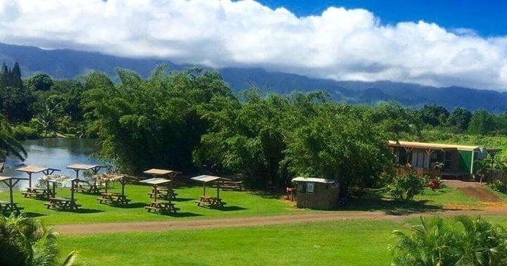 Scenic picnic grounds with lawn and distant mountain backdrop