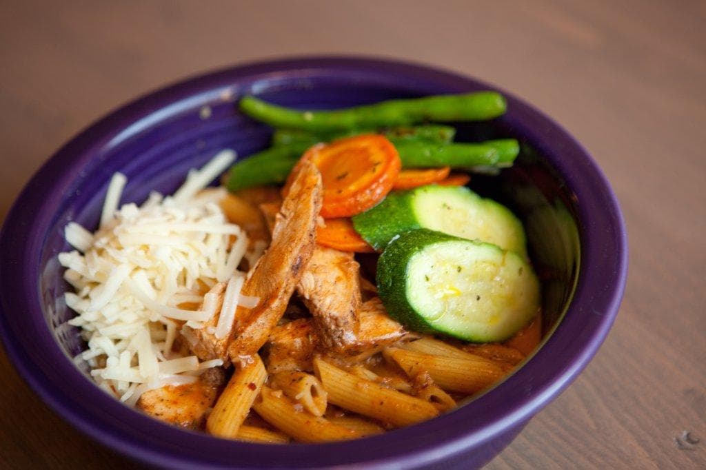 Hearty vegetable and chicken bowl served in casual dining bowl