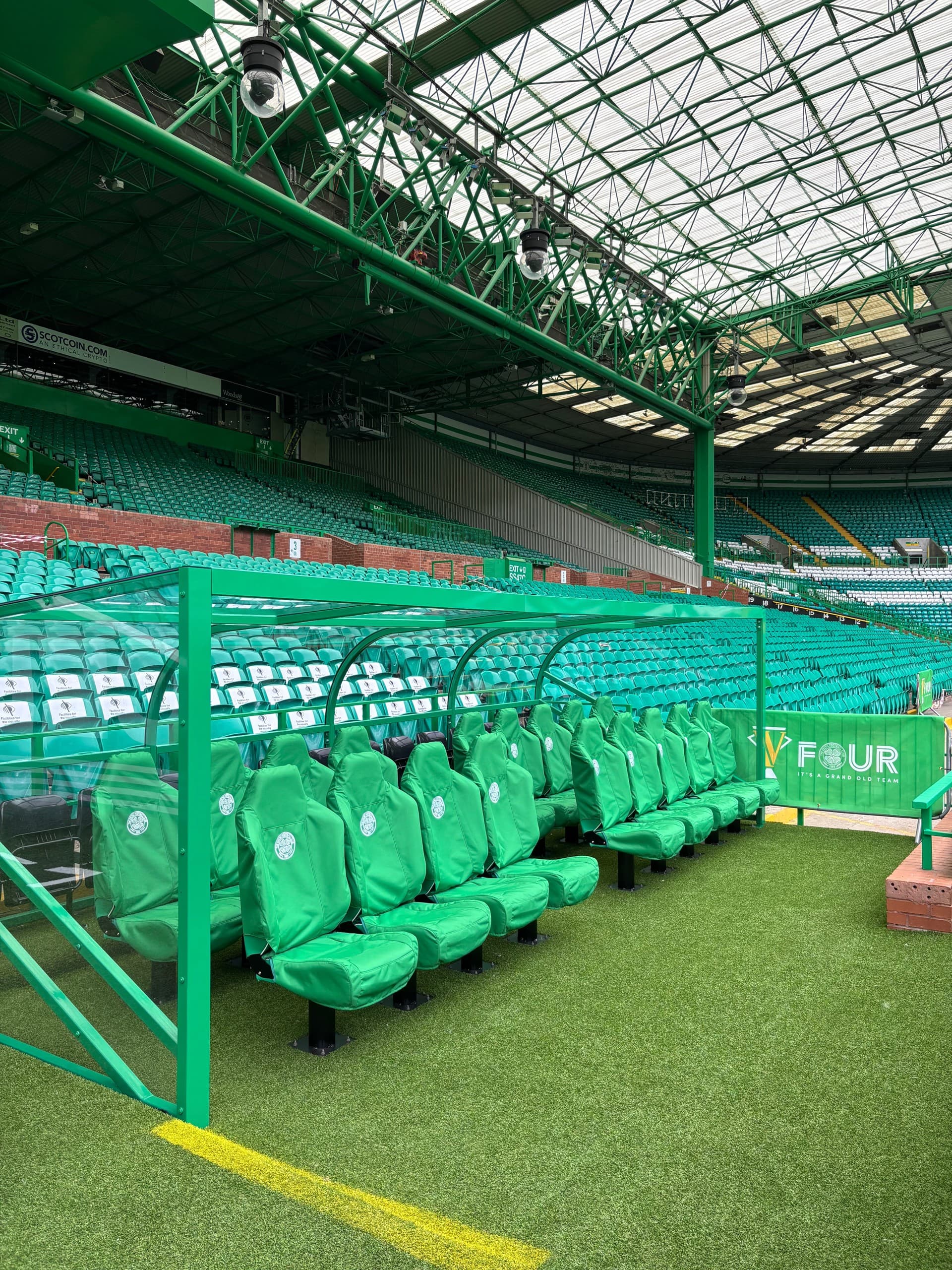 Close-up green spectator seats at Celtic Park stadium