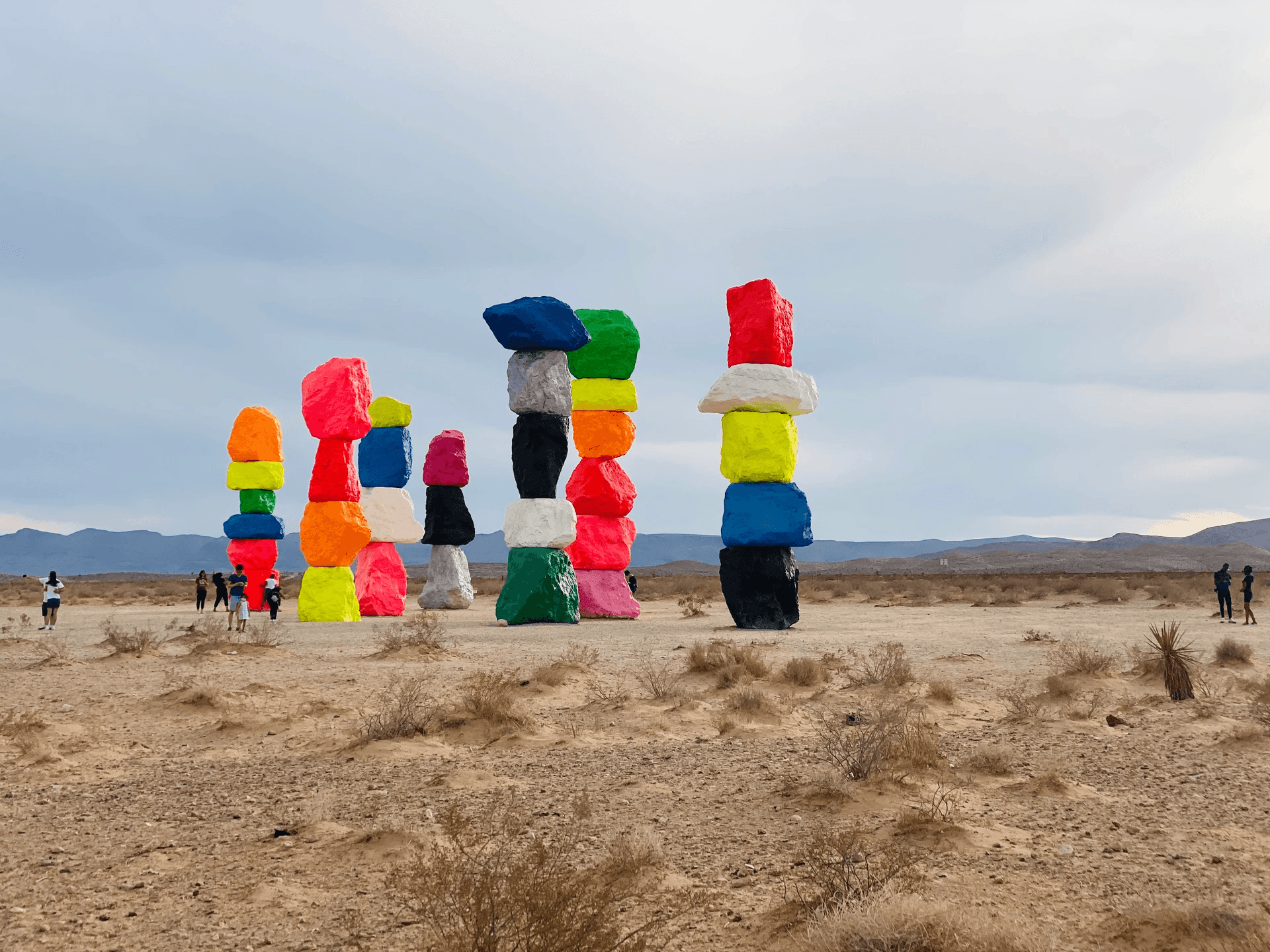 Colorful stacked rock sculptures at desert art installation