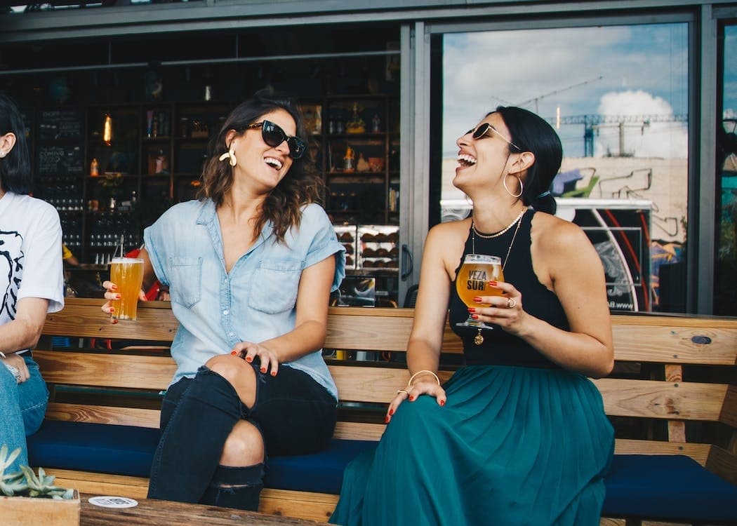 Friends enjoying outdoor craft beer patio seating in San Diego