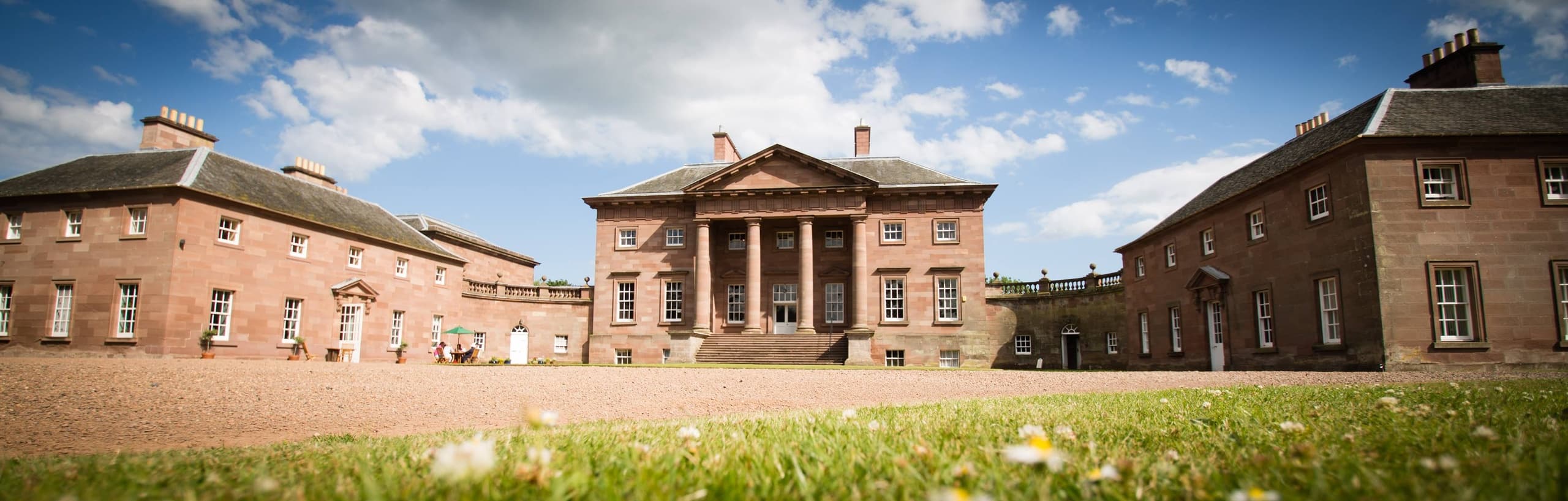 Paxton House grand facade and grounds under blue sky