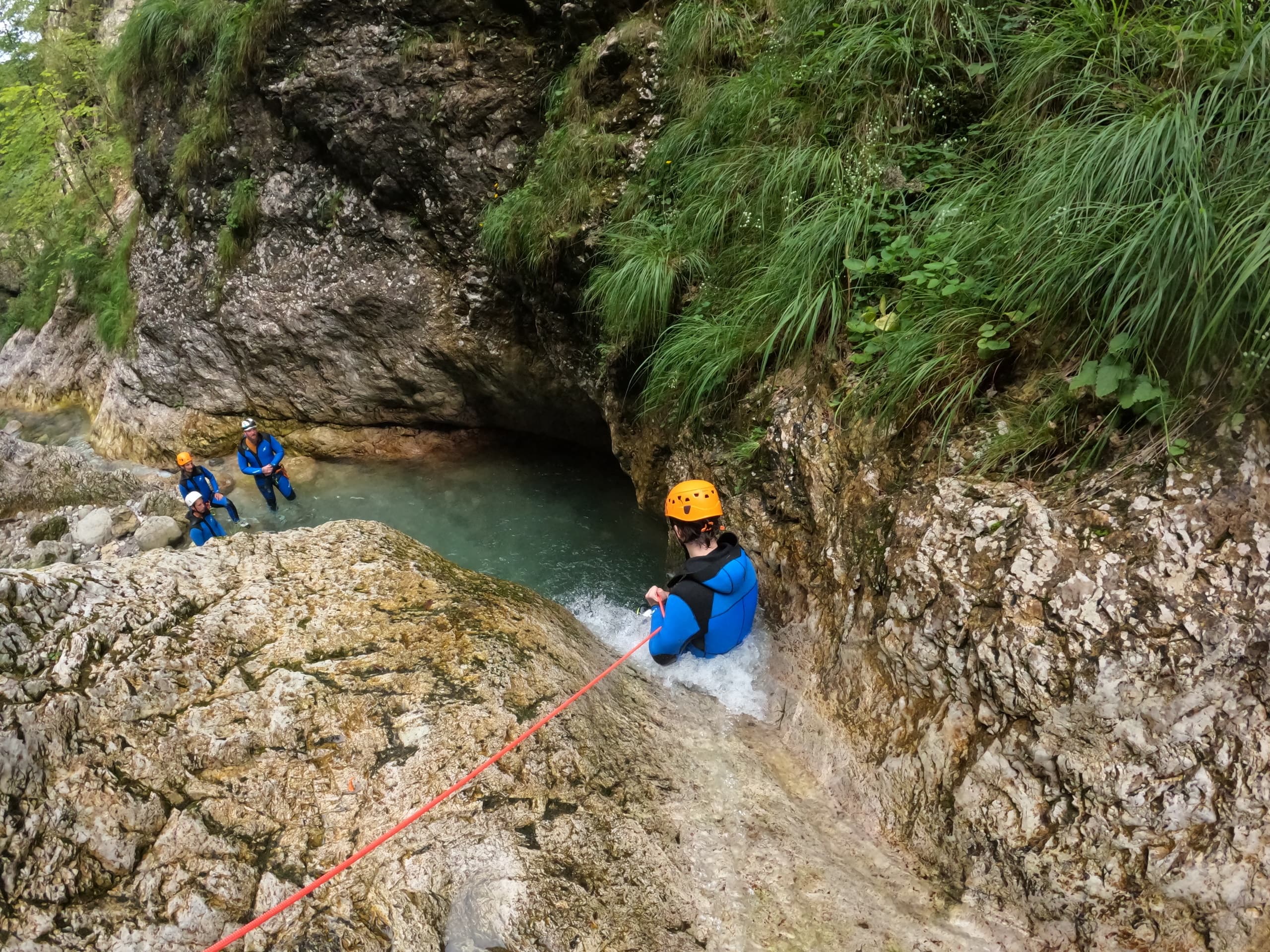 Guide-assisted canyon descent into turquoise canyon pool