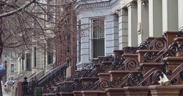 Brownstone stoops and tree-lined row, urban walking tour in NYC