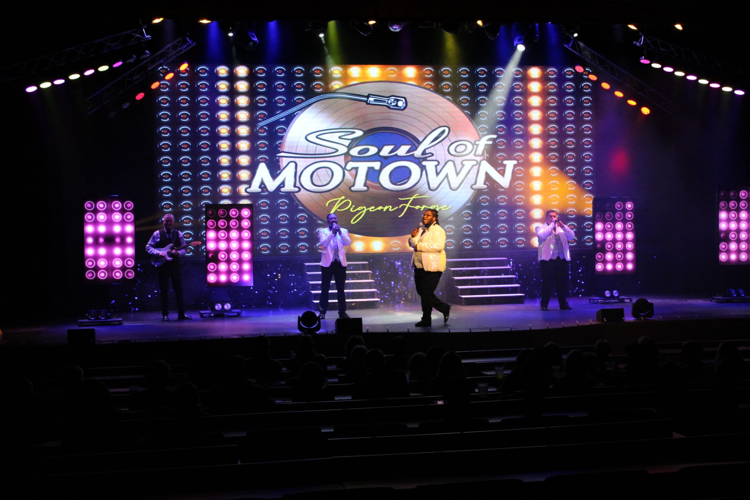 Motown tribute band performing on indoor theater stage in Pigeon Forge