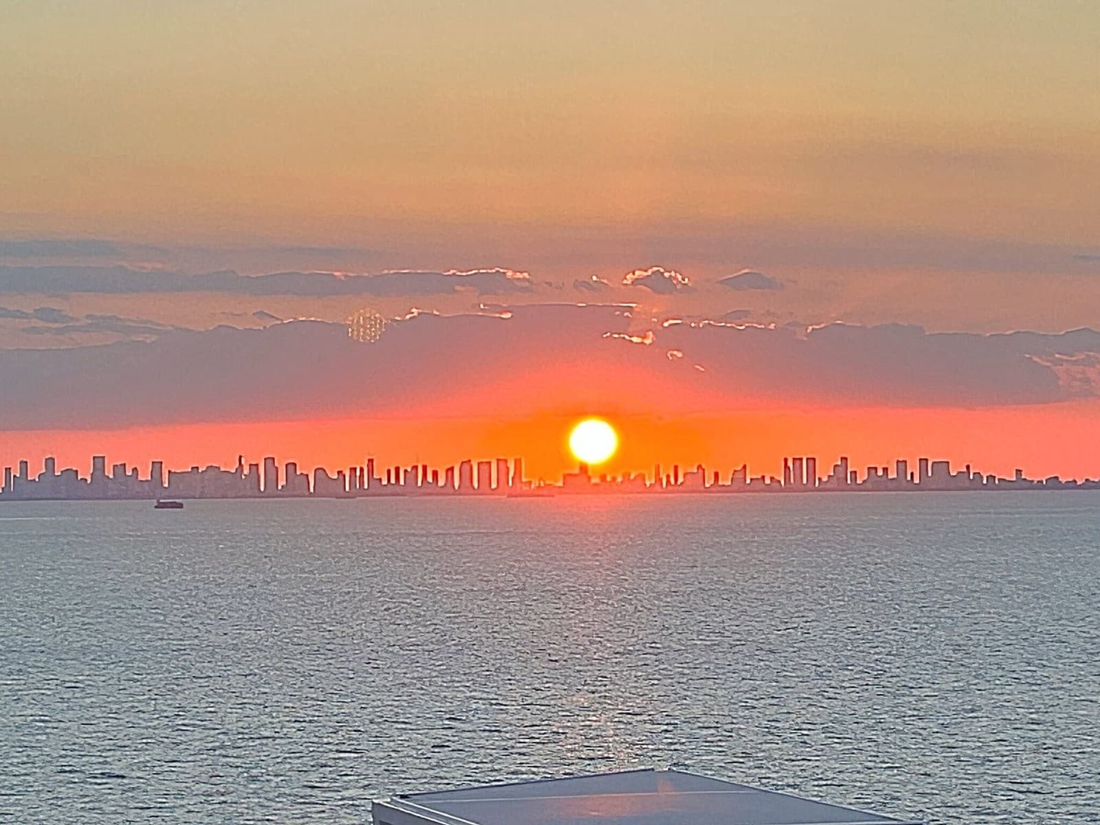 Sunrise over Miami skyline viewed from Biscayne Bay waters
