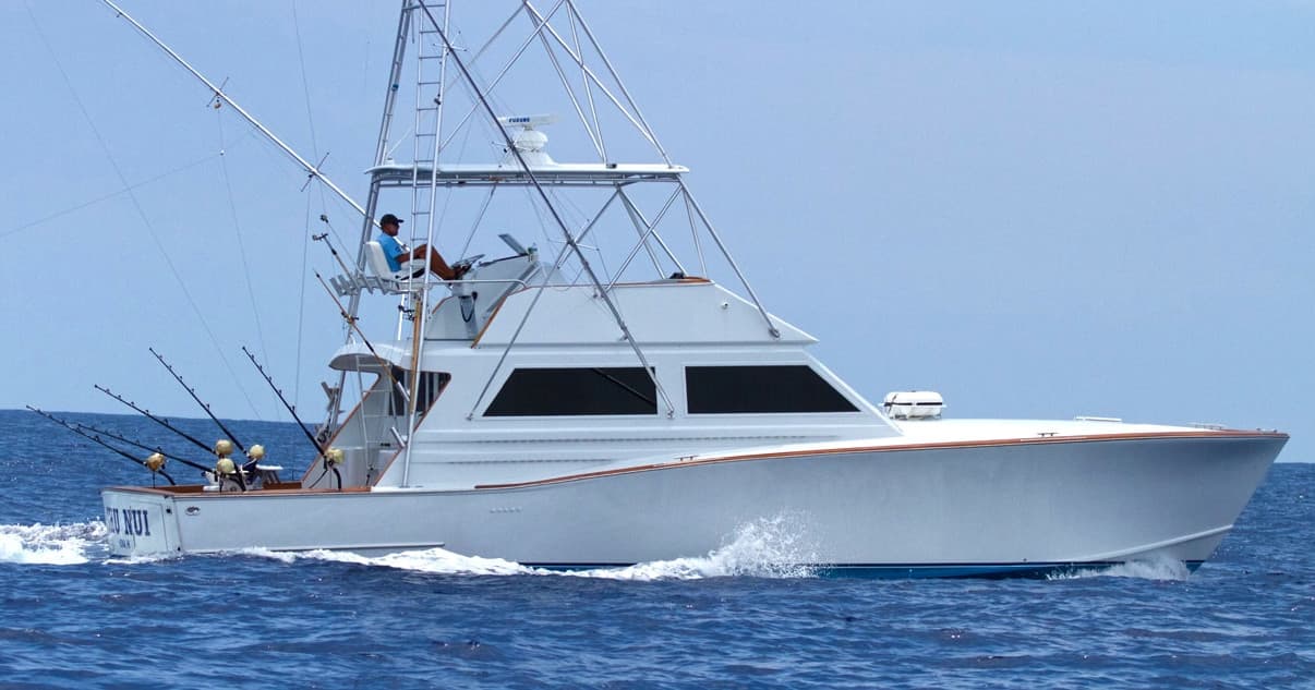 Sportfishing boat cruising offshore on open ocean