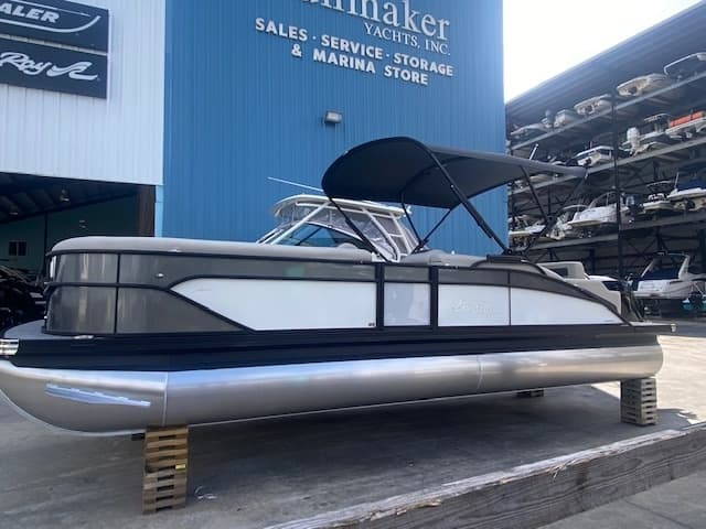 Pontoon yacht sitting on stands at marina sales and storage