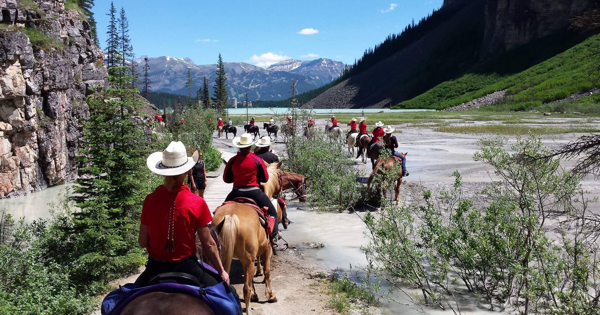 Guided horseback tour through scenic river valley and mountains