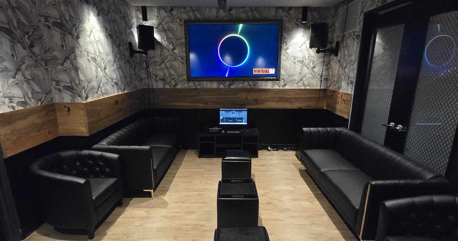 Private karaoke lounge seating with TV screen in cozy room
