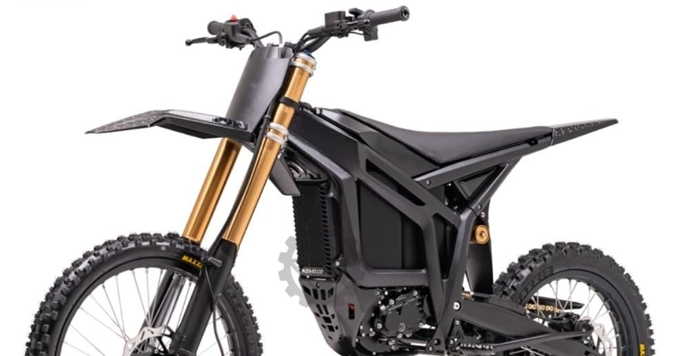 Front angled electric motocross bike in studio, suspension focus