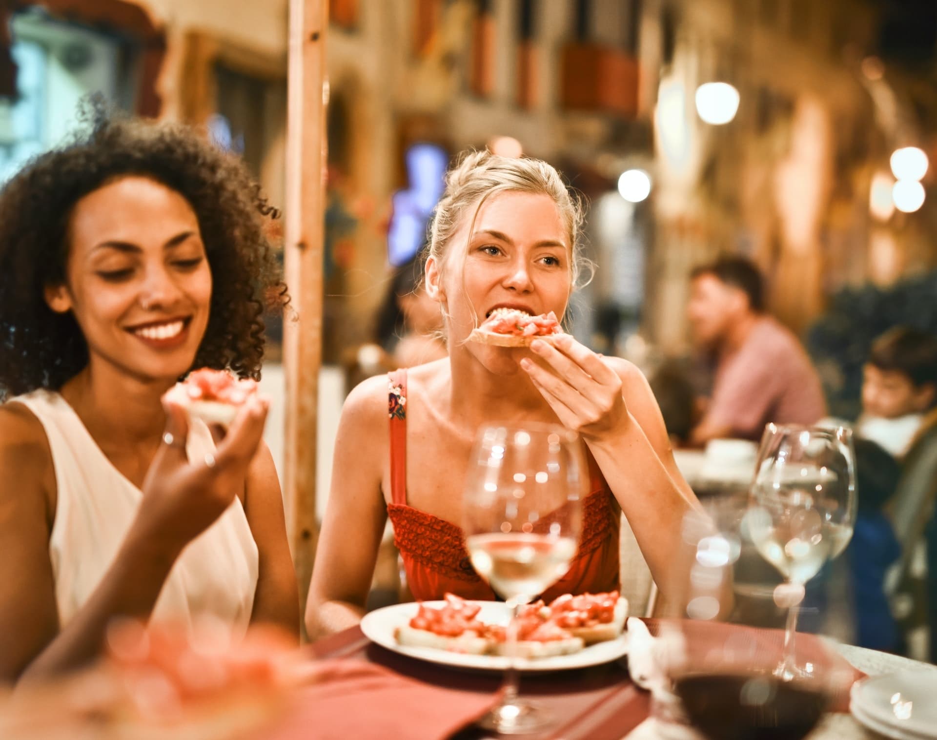 Friends dining al fresco enjoying street food and drinks