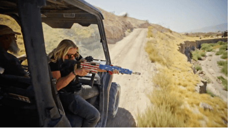 UTV off-road rifle experience with shooter firing across valley