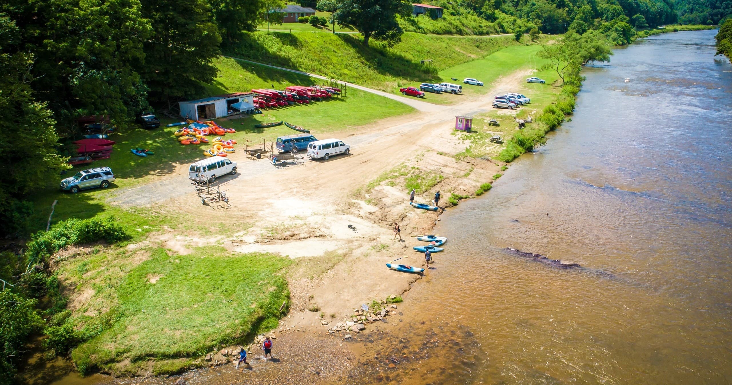 Aerial view of kayakers launching at New River sandy put-in
