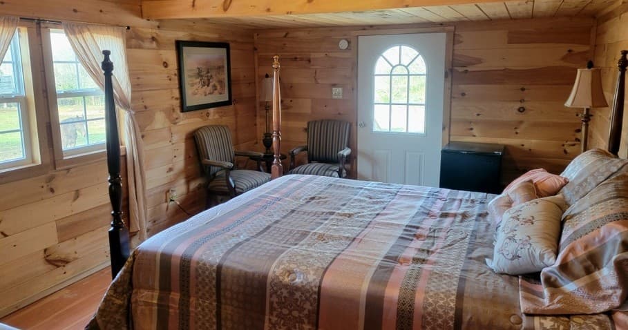 Cozy log-cabin bedroom interior with rustic wood furnishings