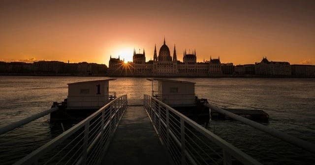 Parliament silhouette at sunset over Danube river in Budapest