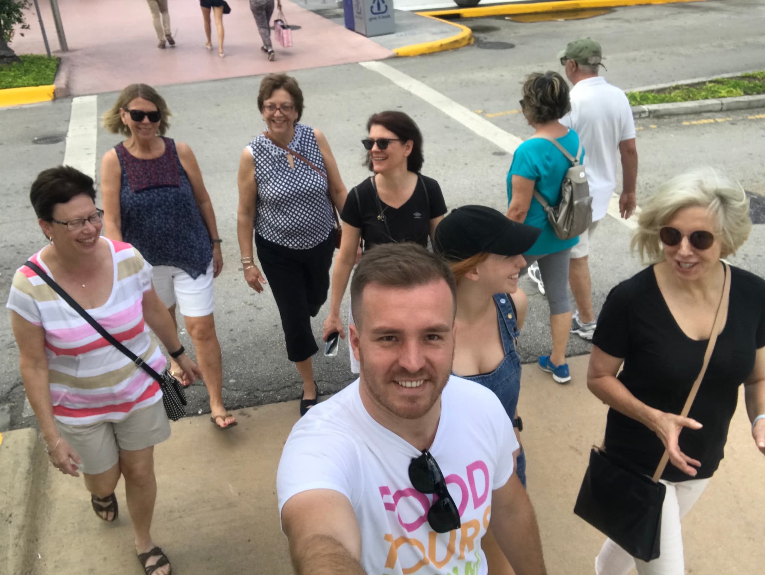 Tourists walking on Miami food tour exploring outdoor streets