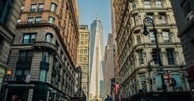 Historic Manhattan street view leading to One World Trade Center