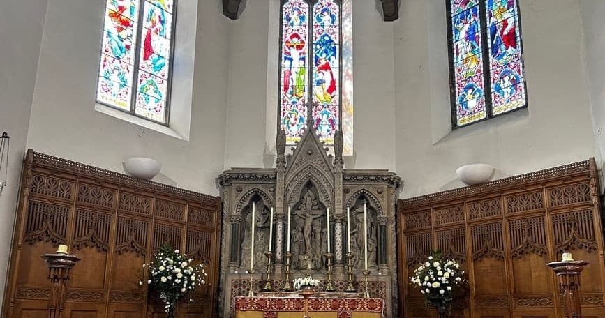 Stone altar and stained glass in Inverness Cathedral chancel