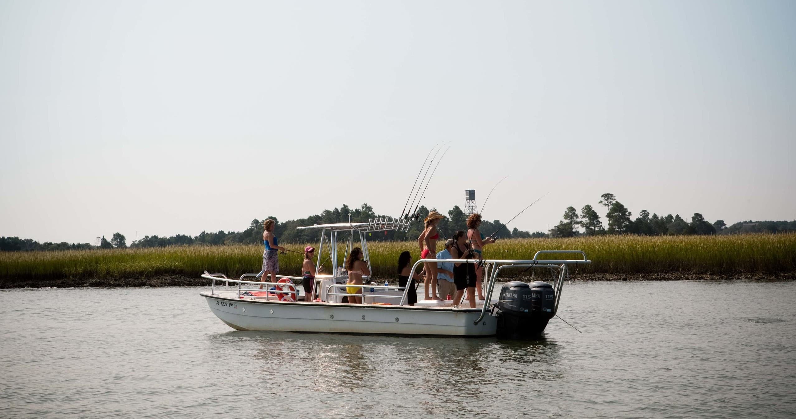 Eco tour boat traveling tidal marshes with wildlife viewing