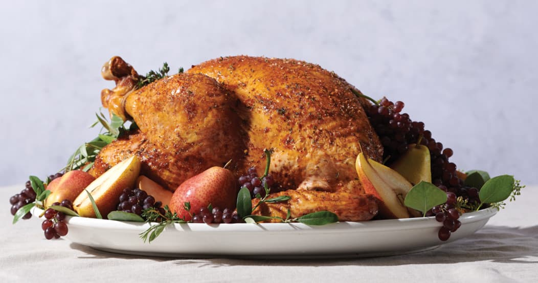 Roasted turkey on platter for holiday display in grocery deli