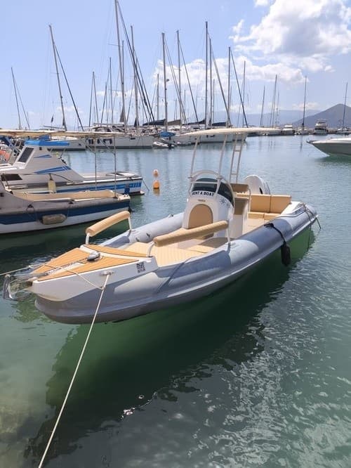 Pilot the Indigo 6.5 "Zafial": Private Half- or Full-Day Boat Rental from Palairos