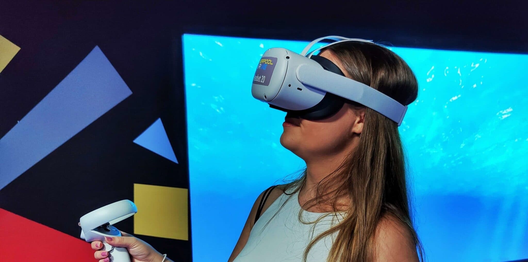 Woman using VR headset in indoor virtual reality arcade demo