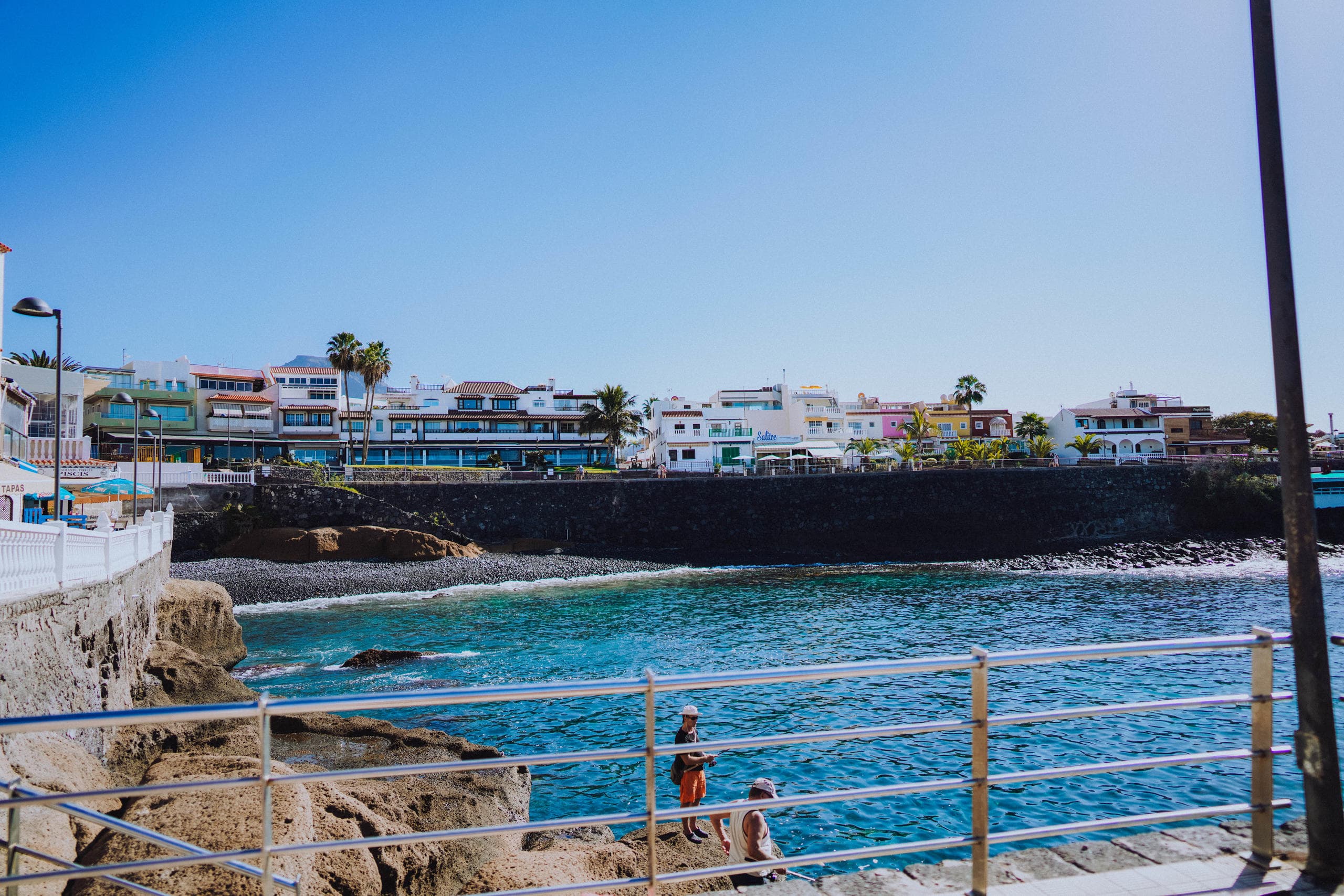 Oceanfront promenade with clear waters and coastal cliffs, Tenerife