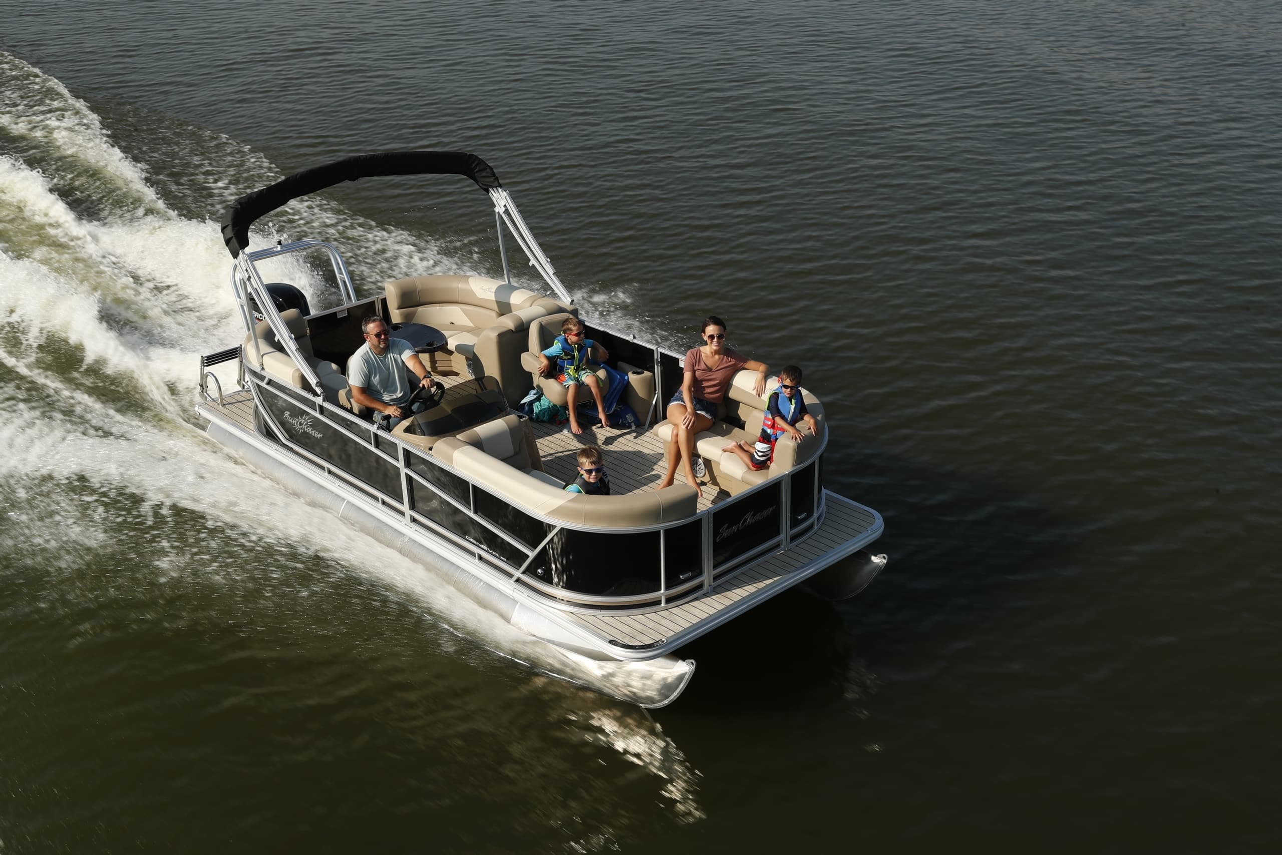 Pontoon cruising with passengers enjoying a fast lake ride