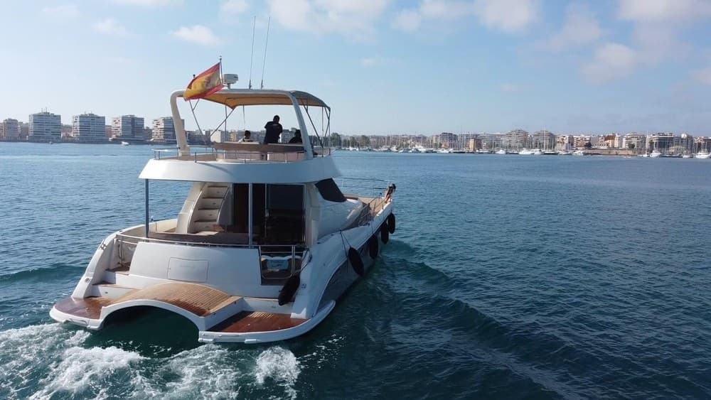 Private motorboat cruising coastal waters with island views in Lanzarote