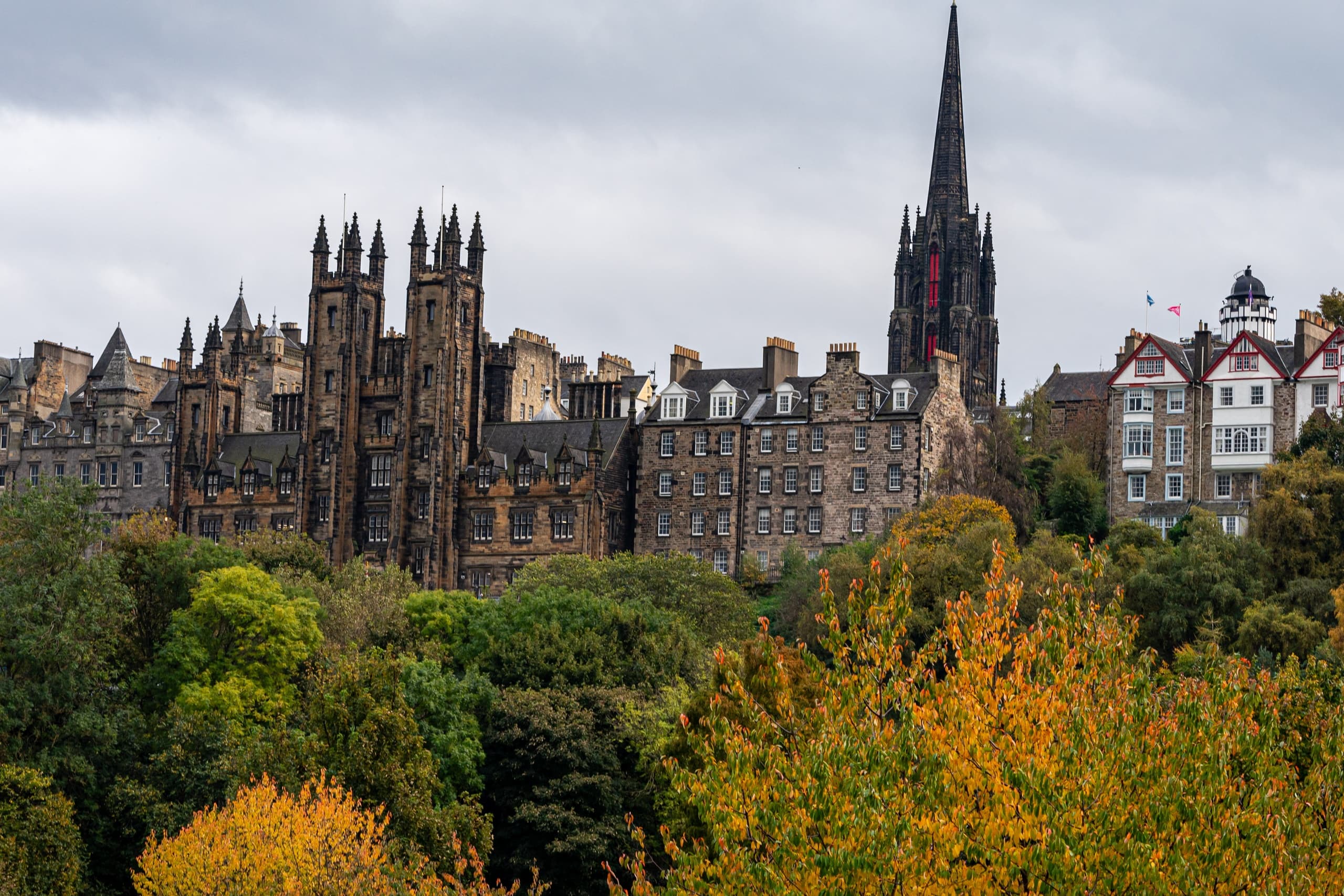 Edinburgh skyline with Gothic spire and autumn park view