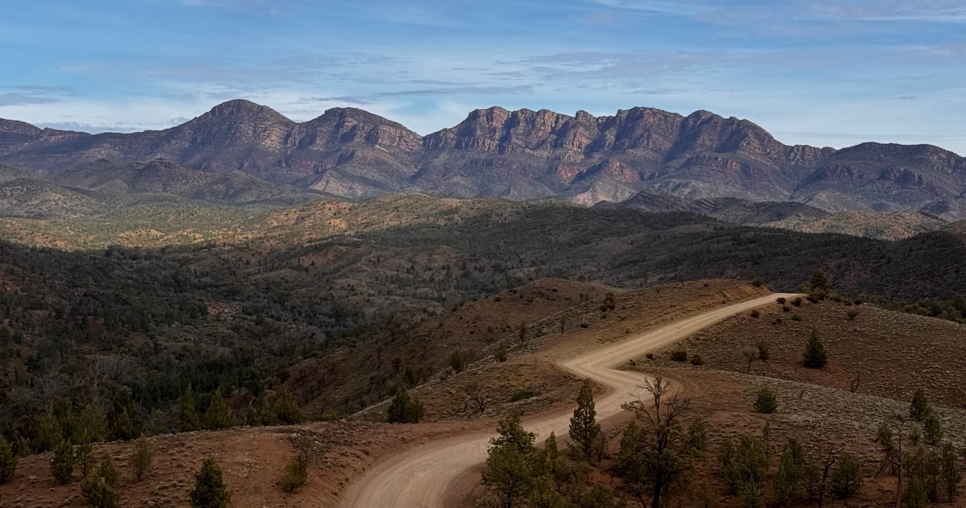Winding dirt track through rugged Flinders Ranges, scenic offroad