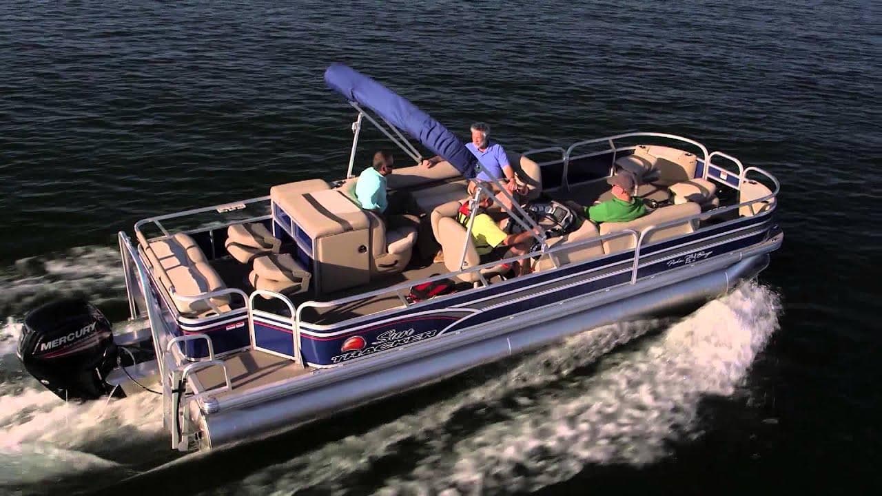 People enjoying wake and sun on a pontoon boat cruise
