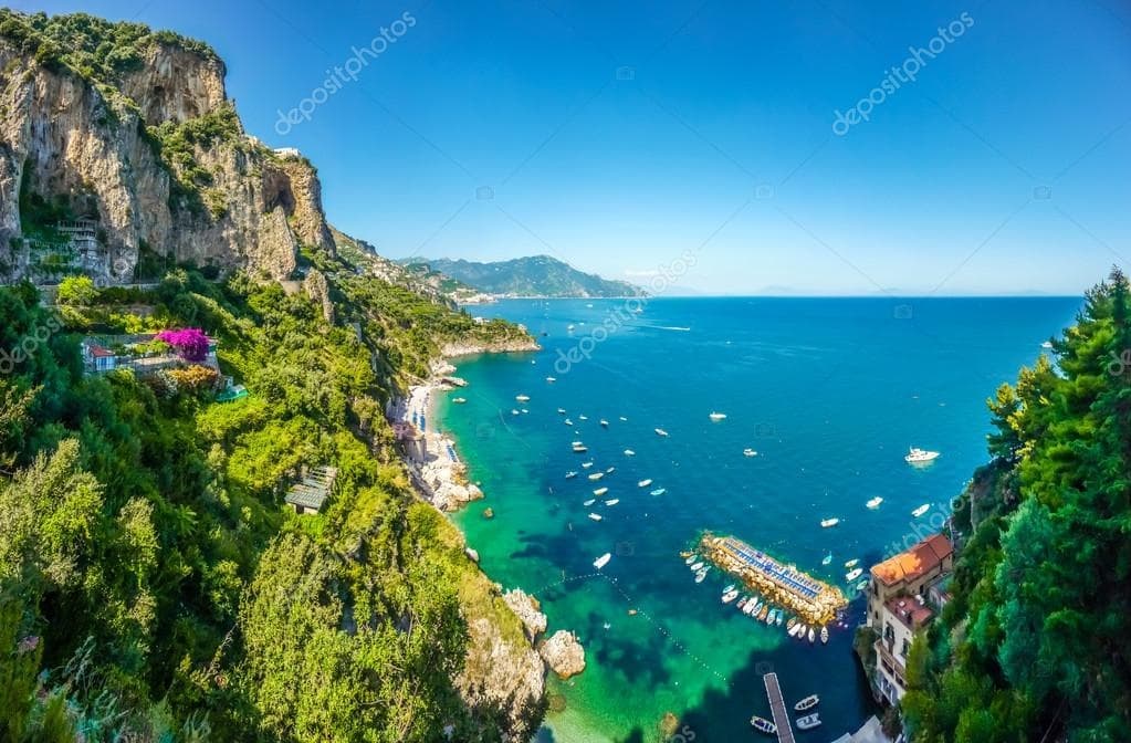 Coastal boat tour along Amalfi cliffs and turquoise coves