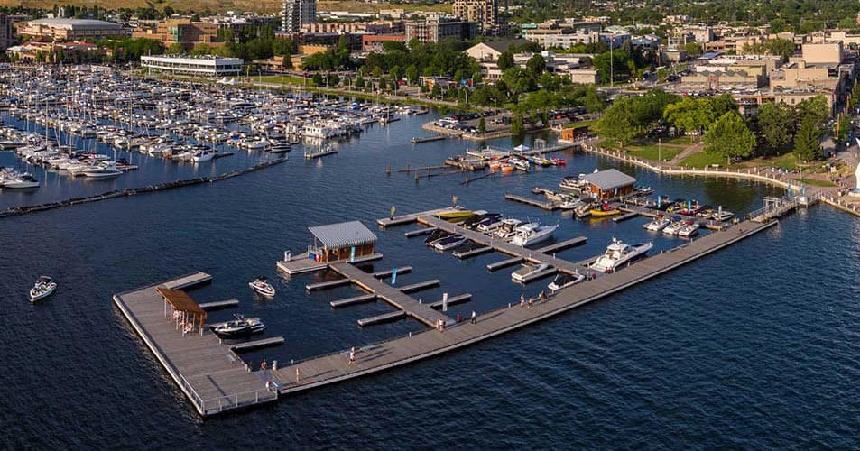 Aerial marina docks and Kelowna waterfront panorama on Okanagan Lake