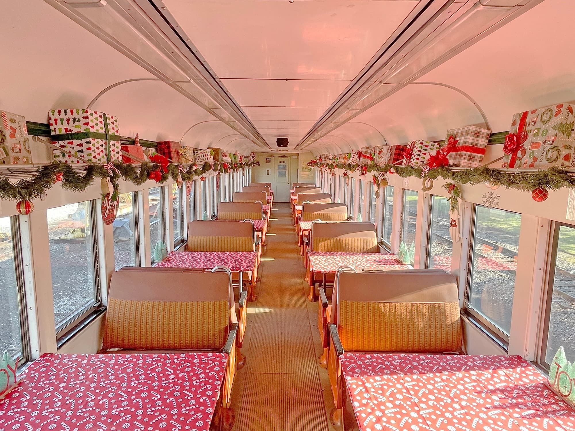 Festive passenger train interior decorated for holiday scenic rides