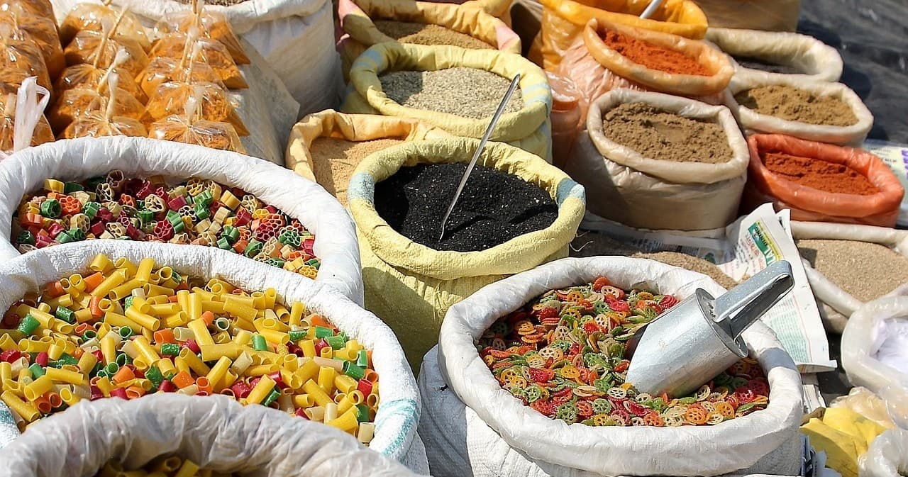 Open-air spice market sacks of colorful spices in India