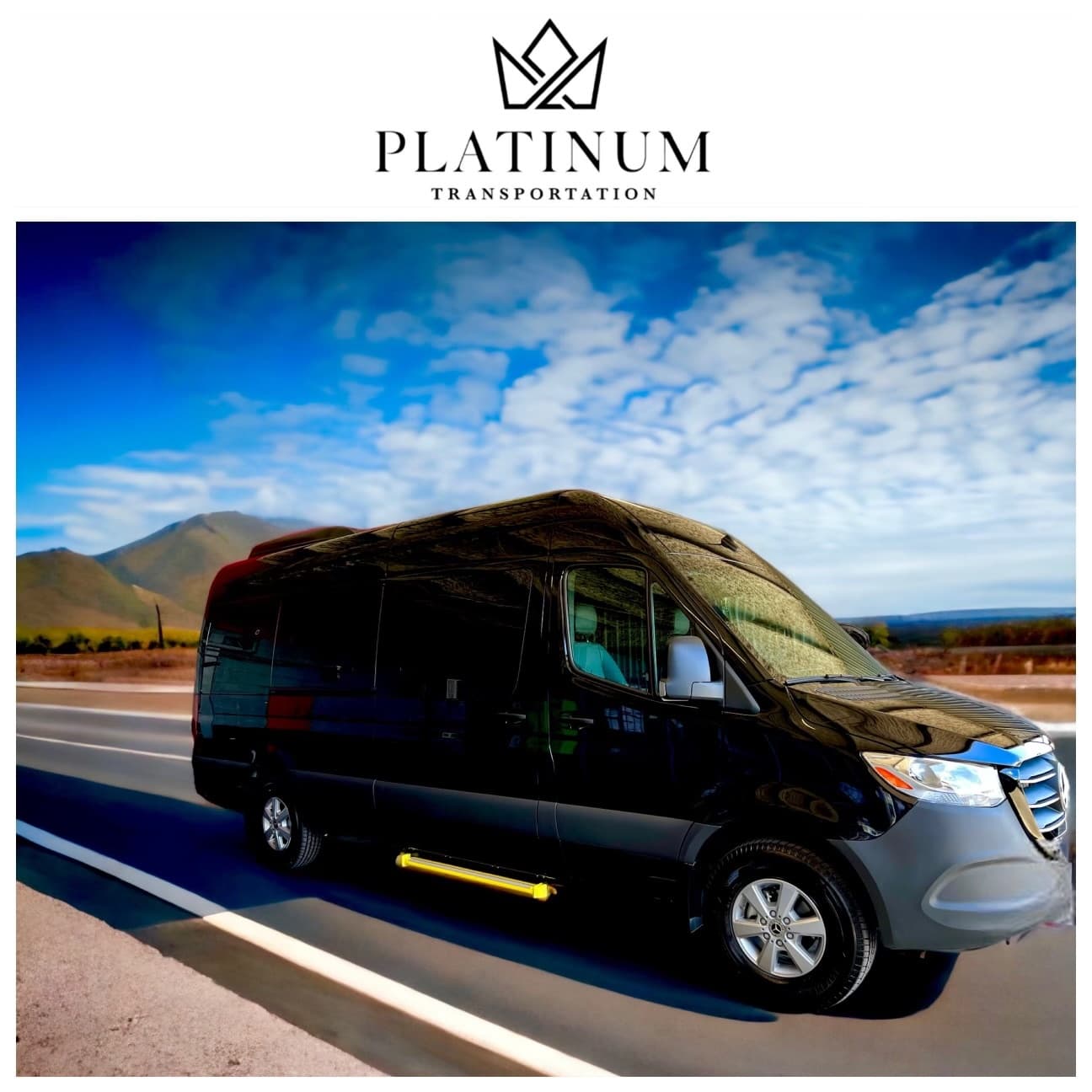 Shuttle van driving on highway toward mountain vista under blue sky