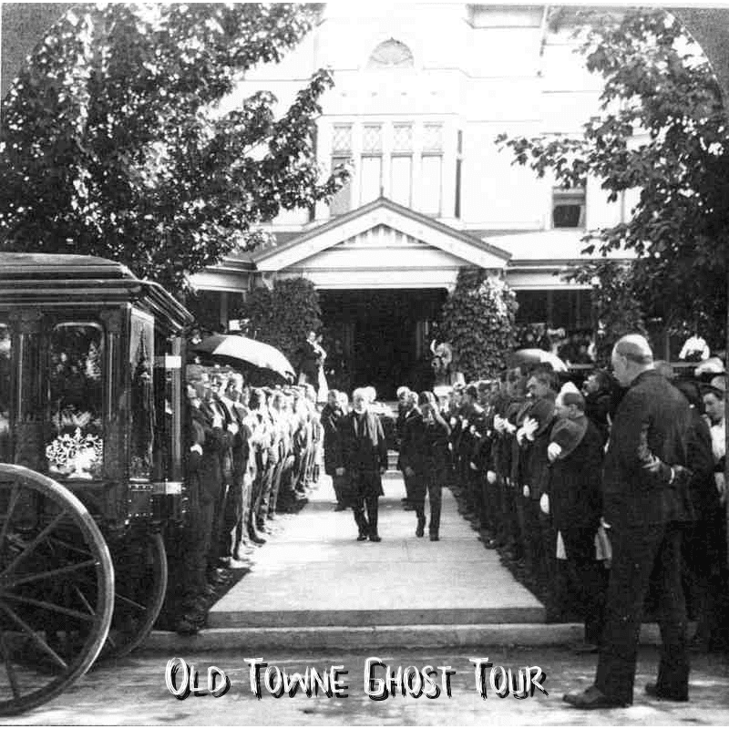 Historic outdoor ghost tour procession outside Victorian home