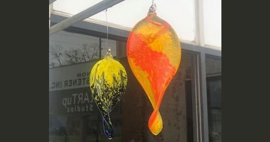 Bright fused glass heart dishes set for craft display indoors