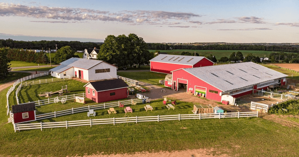 Scenic farm landscape with barns, fences and open fields