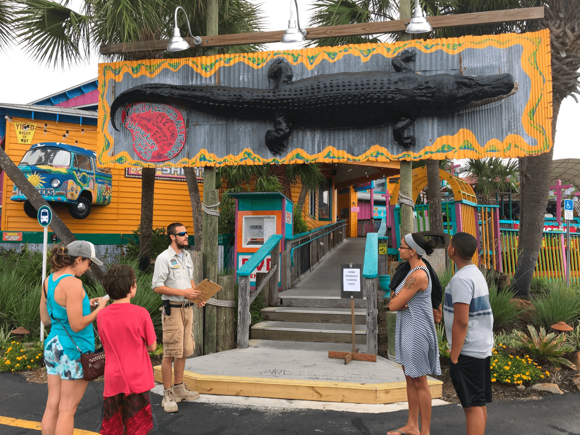 Guided gator park entrance with ranger briefing visitors outdoors