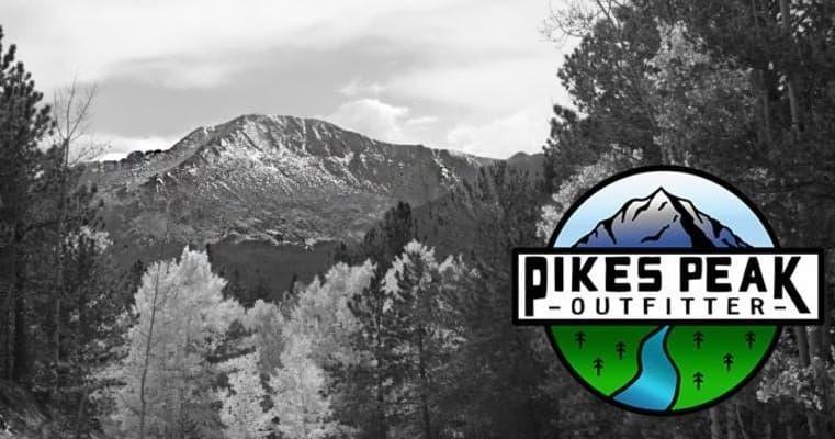 Scenic mountain backdrop with Pikes Peak Outfitter logo