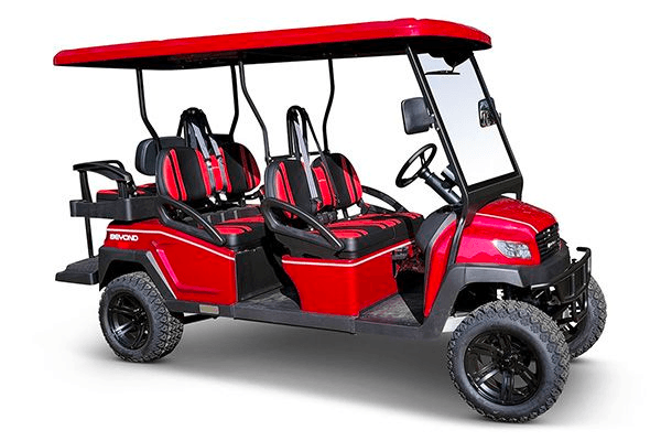 Red six-seat custom golf cart for resort transport on white studio
