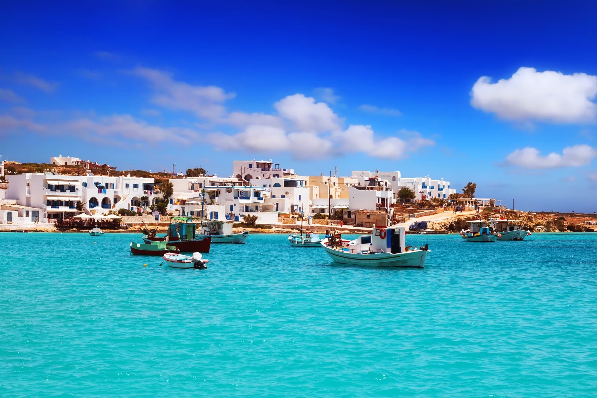 Fishing boats in turquoise bay, Cyclades island boat cruise