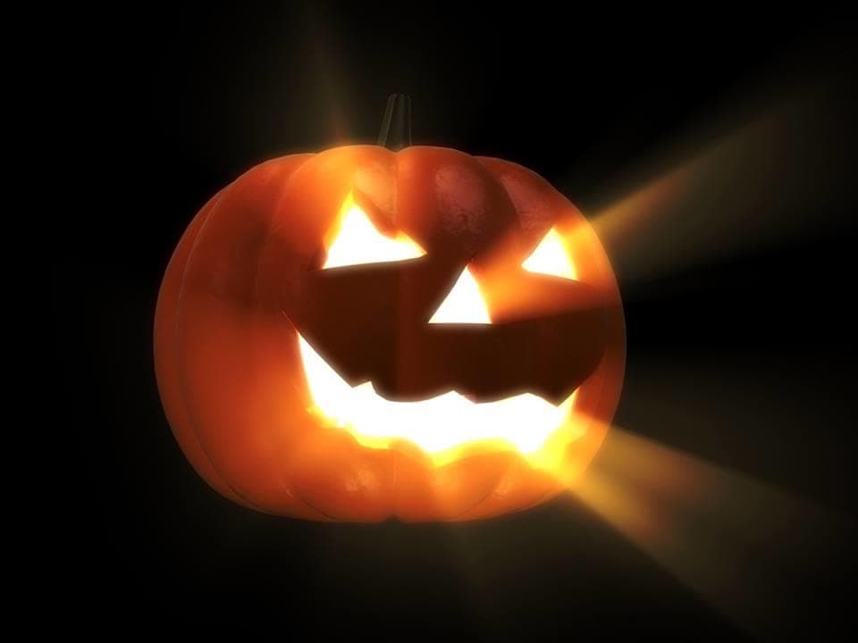 Glowing jack-o'-lantern promoting Salem haunted magic show