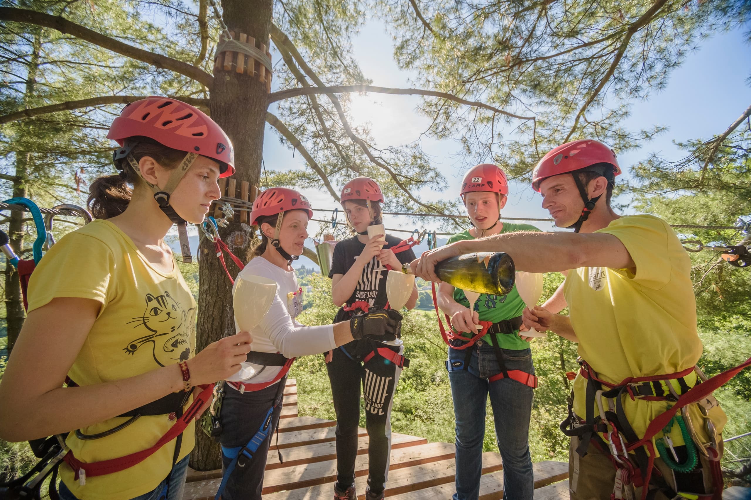 Guides briefing participants on safety gear at rope park